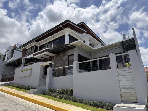 FULLY FURNISHED HOUSE AND LOT FOR SALE WITH SWIMMING POOL    LOCATION: Vista Grande Subdivision, Talisay City, Cebu  PROPERTY DETAILS   Total Lot Area: 315 sq.m. Or 3390.63 sq.ft. Floor Area: Estimated 450 sq.m. More or less  4- Bedrooms with own toilet a