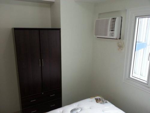 Bedroom with A/C Cabinet & Window